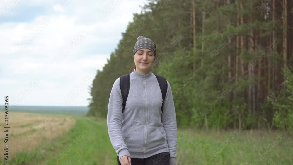 Young brunette woman is walking in the nature. Young brunette woman is walking in the nature.