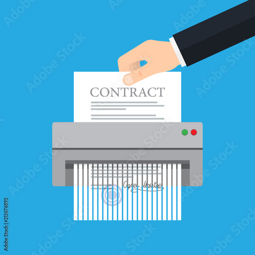 Hand putting paper in shredder machine