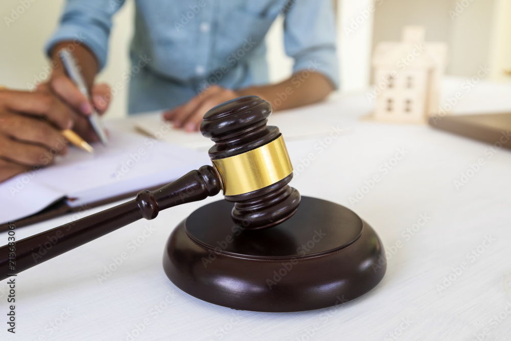 Judge gavel with lawyer bakground. Concepts of housing and real estate law. Judge gavel with lawyer bakground. Concepts of housing and real estate law.