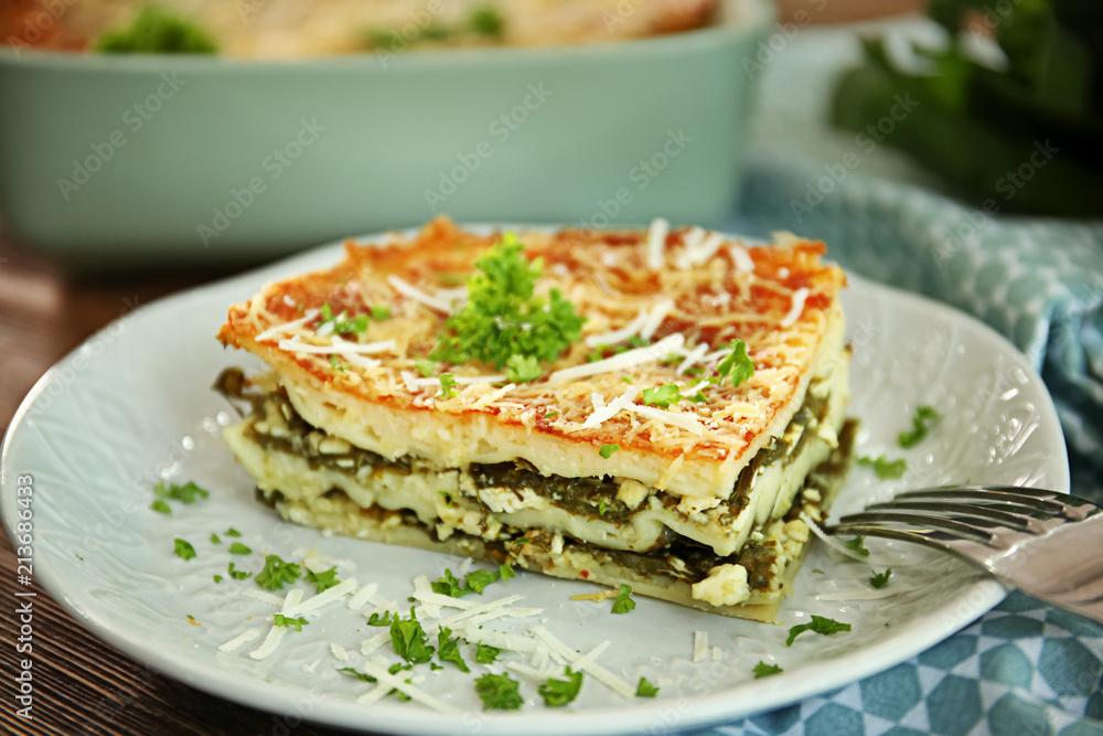 Lasagna with spinach on plate, close up Lasagna with spinach on plate, close up