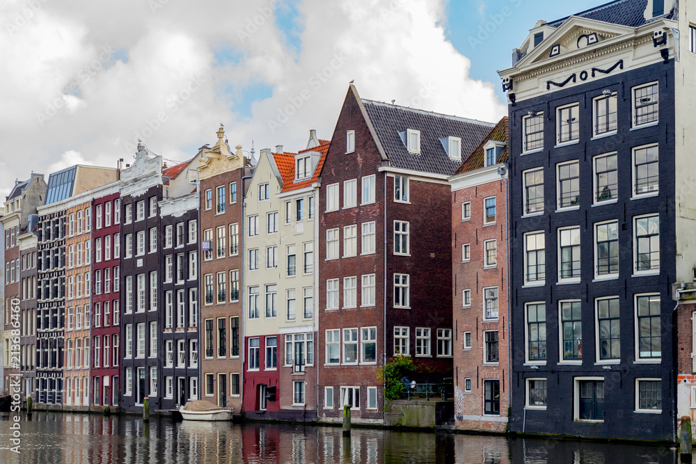 Canal houses in Amsterdam reflecting in the water