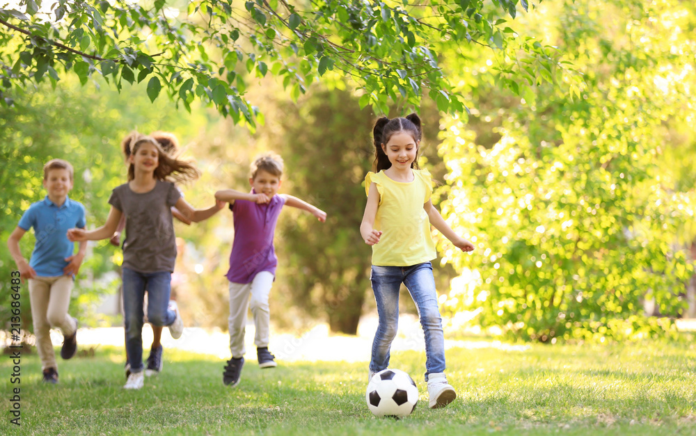 Cute little children playing with ball outdoors on sunny day Cute little children playing with ball outdoors on sunny day