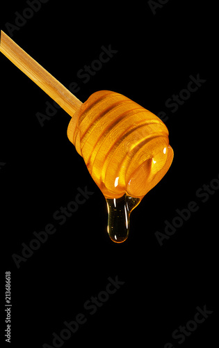Sweet honey on the black background 