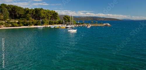 Turcoise water with white boats, Krk Island, Croatia. photo