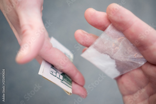 Drug selling concept. Close up hands, trading meth.