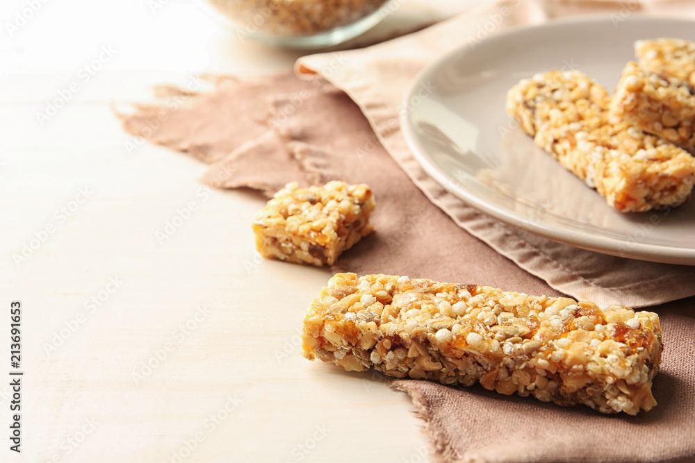 Homemade grain cereal bar on table, closeup. Healthy snack Homemade grain cereal bar on table, closeup. Healthy snack