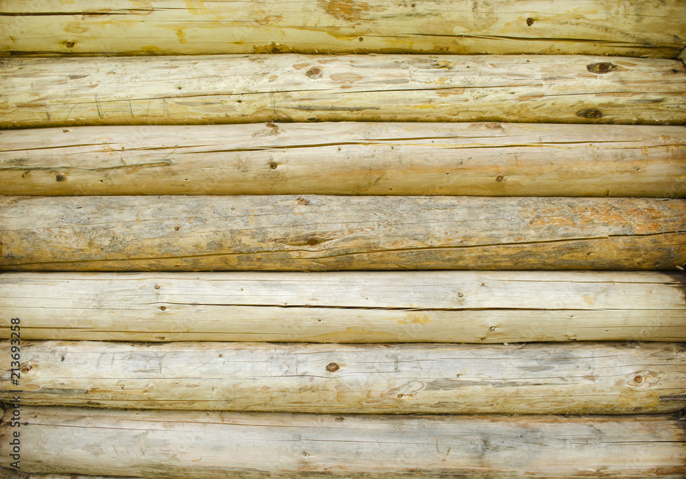 Obraz premium Blocks of wood stacked as wall. Wooden background with light colors. Pattern, texture.