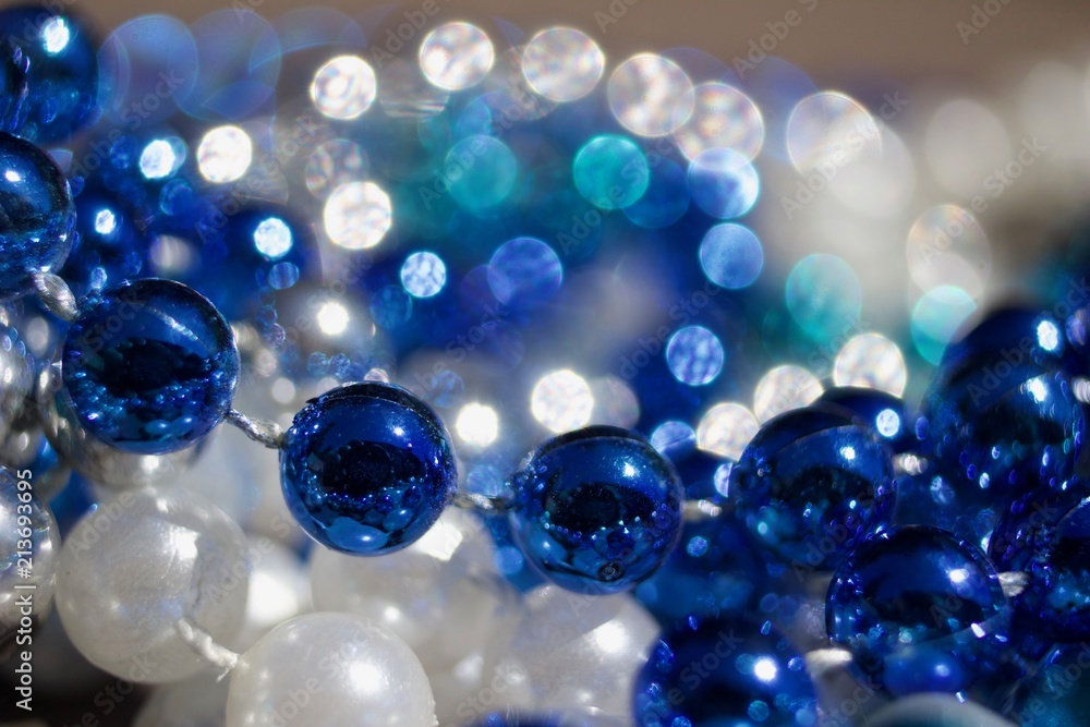 Macro bokeh beads abstract design background of blue, white, and turquoise color Macro bokeh beads abstract design background of blue, white, and turquoise color