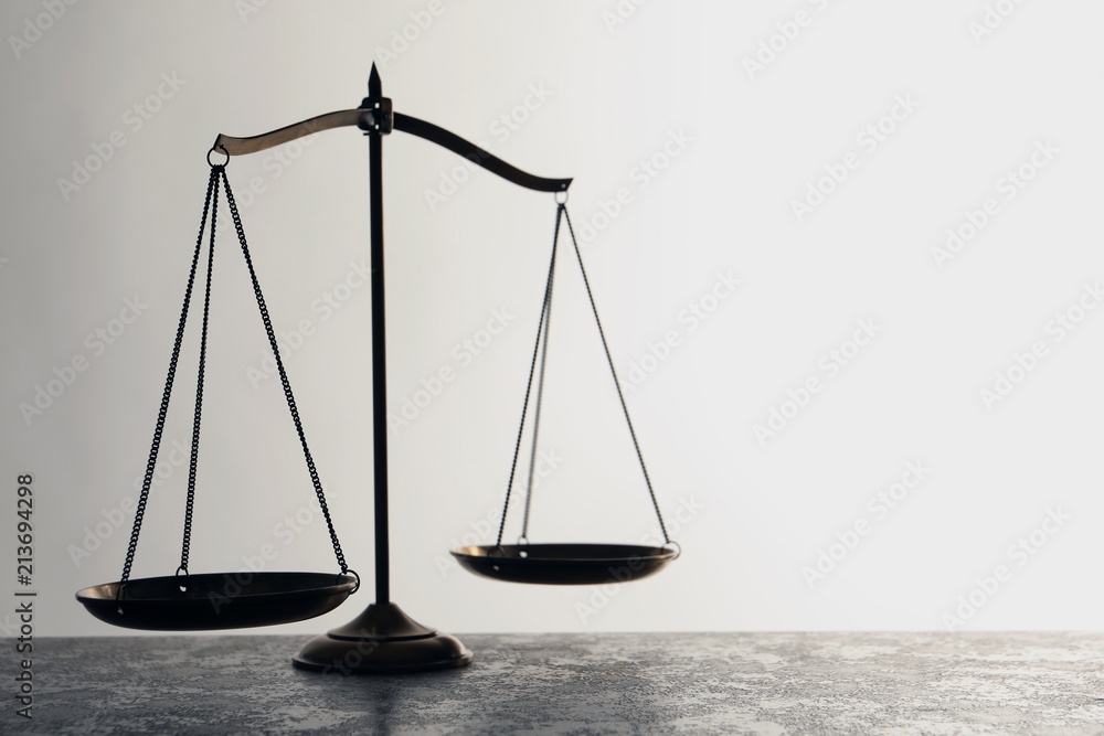 Scales of justice on table. Law concept Scales of justice on table. Law concept
