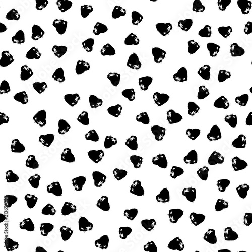 Vector seamless pattern with brush heartss. Black color on white background. Hand painted grange texture. Ink grange elements. Decorative ornament of love sign. Repeat fabric print.