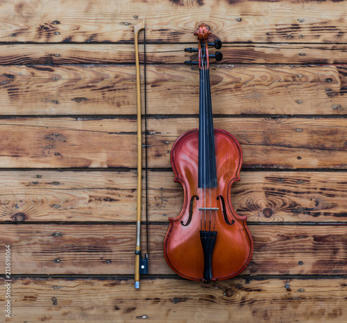 violin on an old wooden table © serikbaib