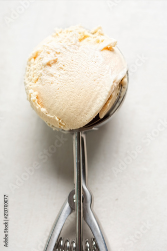 Salted caramel ice creams on ice cream scoop