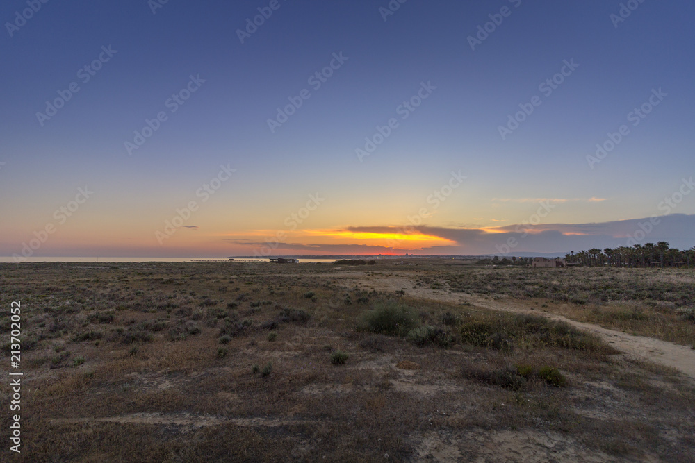 Sunset seascape of Salgados beach in Albufeira, Algarve.