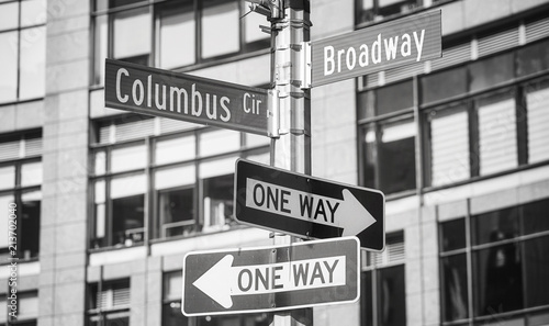 Black and white picture of Broadway and Columbus Circle street name signs, New York City, USA. © MaciejBledowski