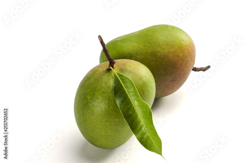 Mangoes with stem and leaf isolated on white background