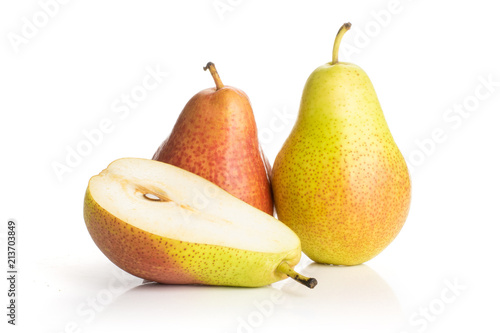 Group of two whole one half of fresh red pear forelle variety isolated on white