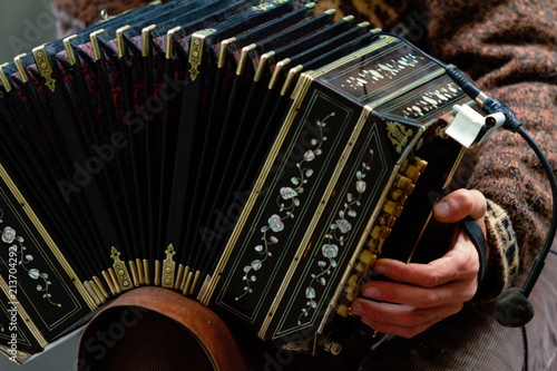 Close-up of street bandoneon player playing tango