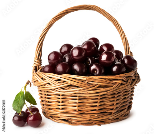 Full basket of ripe red cherries on a white, isolated.