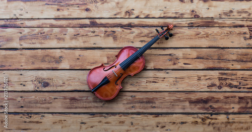 violin on an old wooden table © serikbaib