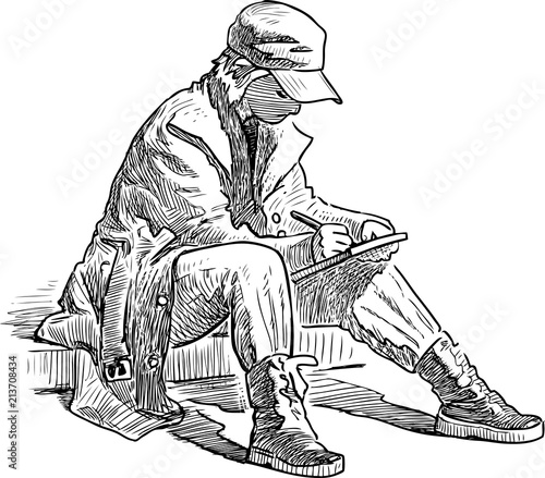 A young person is sketching in open air