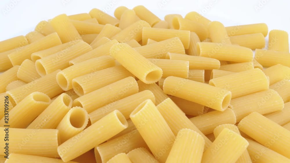 Macaroni pasta rotating an withe background (loopable) Macaroni pasta rotating an withe background (loopable)