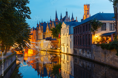 Scenic night cityscape with a medieval tower Belfort and the Green canal, Groenerei, in Bruges, Belgium