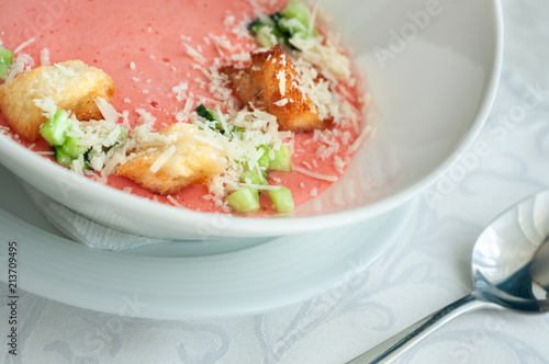 Gazpacho. Cold Refreshing Spanish Soup with Parmesan, pieces of Bread and Cucumber. Served in a restaurant photo