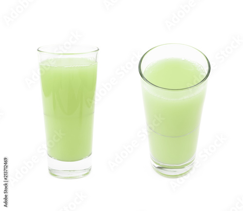 Tall glass of green juice isolated