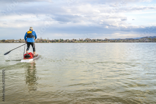 expedition stand up paddleboard on lake