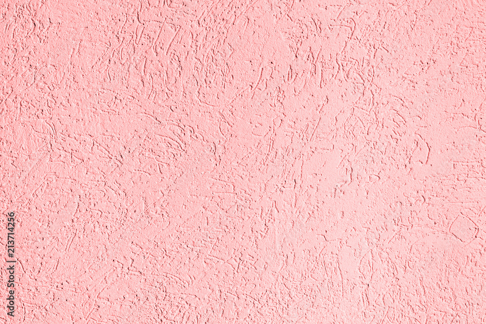 Fototapeta premium texture of the surface of the wall covered with decorative plaster of the woodworm type