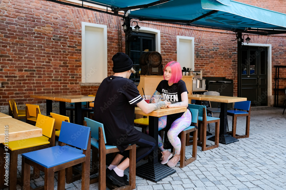 Young couple in love in a summer cafe