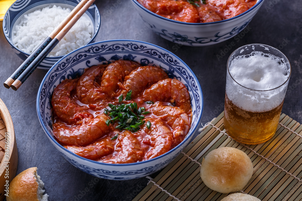 Close view of bowl with big prawn in hot sauce with beer, asian cuisine Close view of bowl with big prawn in hot sauce with beer, asian cuisine