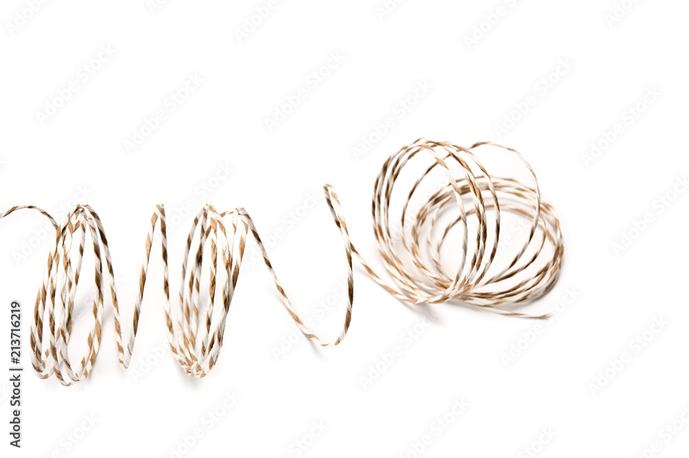 String coils on white background.