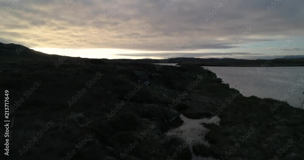 aerial shot of sunset over lake in iceland aerial shot of sunset over lake in iceland