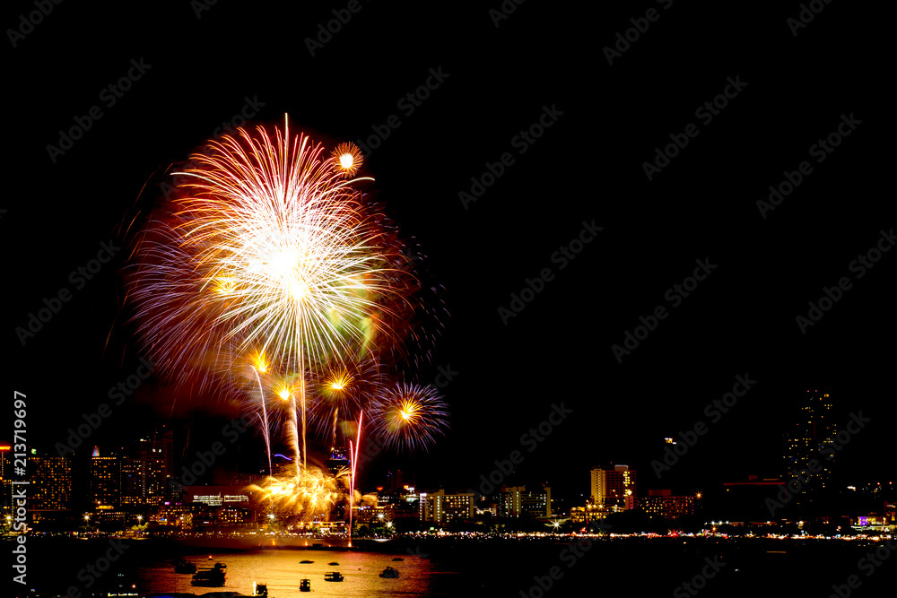 Many flashing fireworks with night cityscape background celebrate New Year. Many flashing fireworks with night cityscape background celebrate New Year.