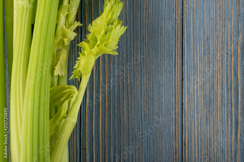 Fototapeta Naklejka Na Ścianę i Meble -  Celery stalks on wood background