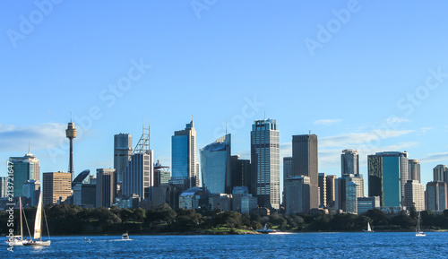 Sydney city cbd buildings with harbour and boats in foreground, Australia