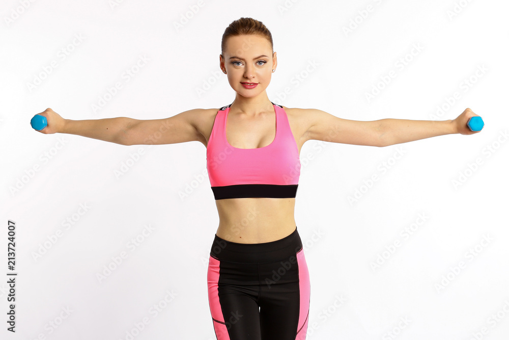 Young girl athlete, fitness with dumbbells isolated on white background Young girl athlete, fitness with dumbbells isolated on white background