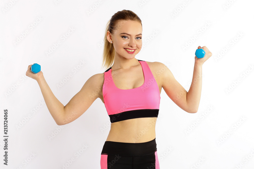 Young girl athlete, fitness with dumbbells isolated on white background Young girl athlete, fitness with dumbbells isolated on white background