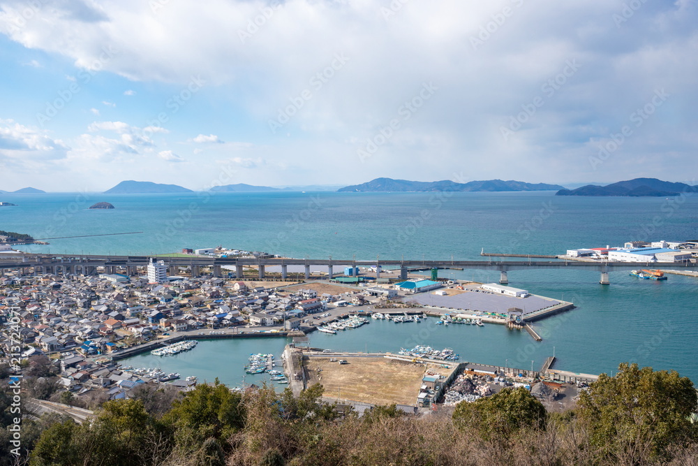 Landscape of Local fishing port and Seto ohashi railway in Seto inland sea,Kagawa,Shikoku,Japan