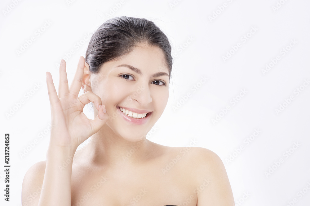Beautiful smiling woman with natural make-up, clean skin and white teeth on white background. Beautiful smiling woman with natural make-up, clean skin and white teeth on white background.