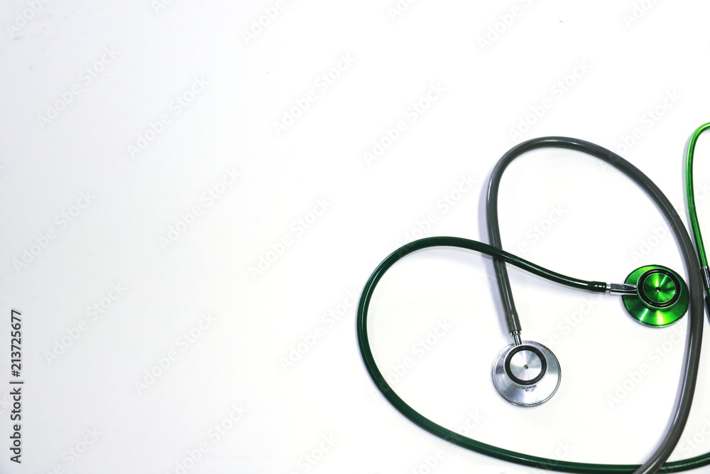 Green and silver stethoscope. Stethoscope check heart .Stethoscope show good health and caring concept. Green and silver stethoscope. Stethoscope check heart .Stethoscope show good health and caring concept.