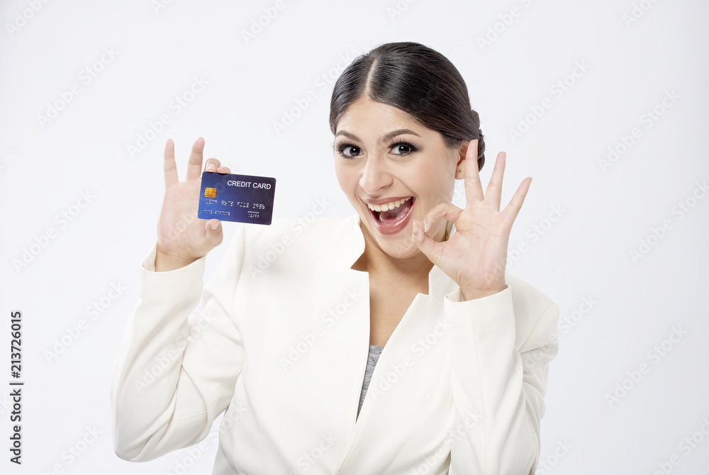 beautiful young woman holding credit card over white background beautiful young woman holding credit card over white background