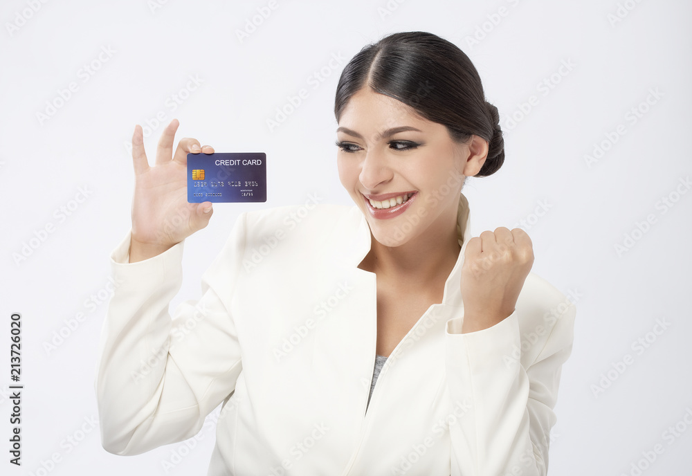 beautiful young woman holding credit card over white background beautiful young woman holding credit card over white background