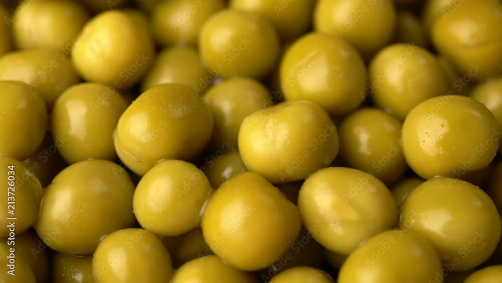 Green pickled peas rotate background. Green pickled peas rotate background.