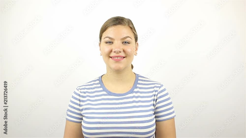 Portrait of a young beautiful woman. Smiling looking at camera. close-up. Portrait of a young beautiful woman. Smiling looking at camera. close-up.