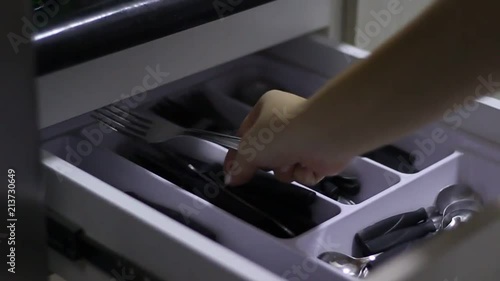 Pick up a fork and knife in the kitchen