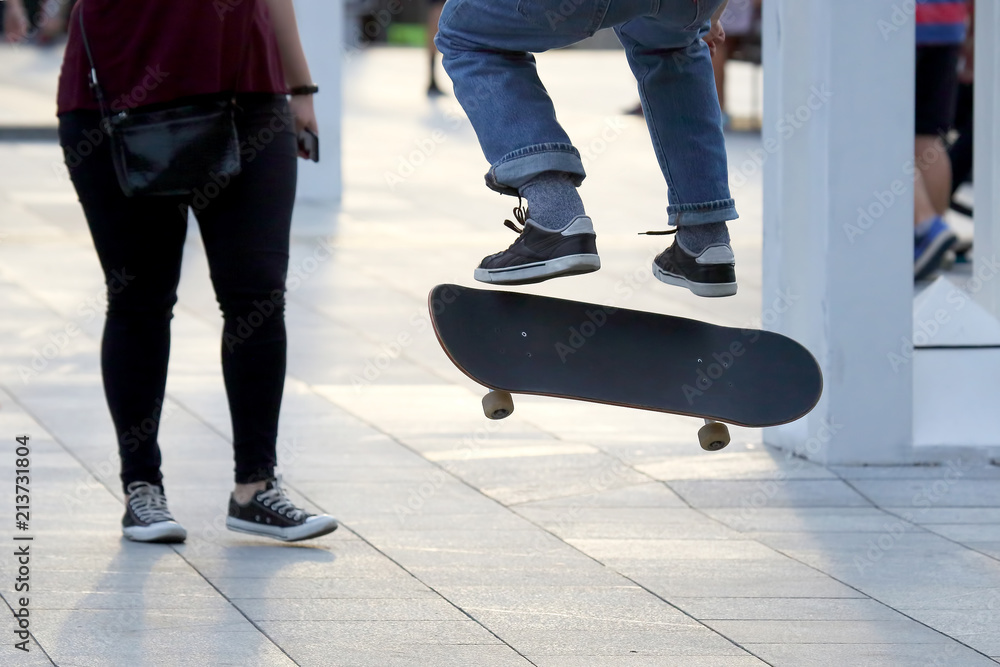 Fototapeta premium jump a young man on a skateboard