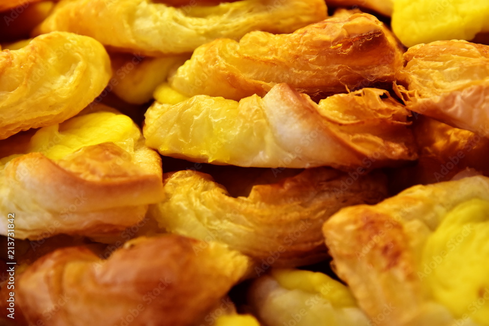 A seamless background of mouth-watering pastry rolls. Close-up A seamless background of mouth-watering pastry rolls. Close-up