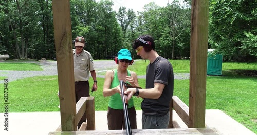 Aerial camera descends onto a wobble range with shooters in their respective stations.